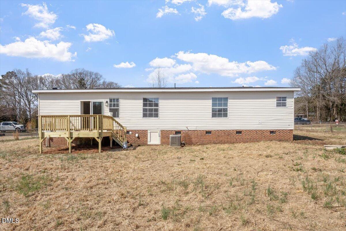 10965 Beaver Dam Road Middlesex, NC 27557 - Photo 20 of 24 a backyard of a house with table and chairs