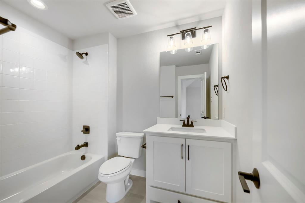 800 Blackberry Road Haslet, TX 76052 - Photo 24 of 28 Bathroom featuring a white vanity with a rectangular undermount sink and a light-colored countertop