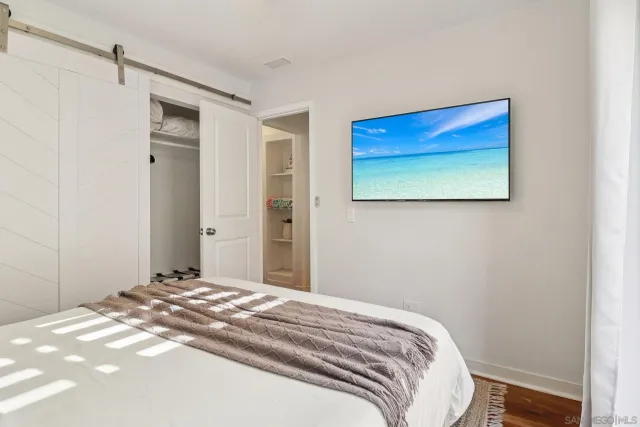 a bathroom with a double vanity sink mirror and shower
