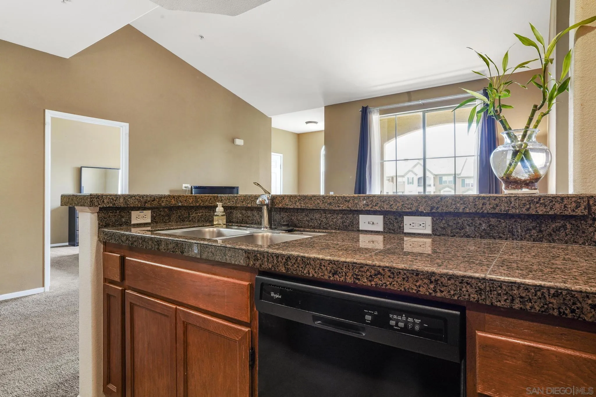 1853 Rue Bienville Place, Unit 833 Chula Vista, CA 91913 - Photo 12 of 23 a kitchen with a sink and a window
