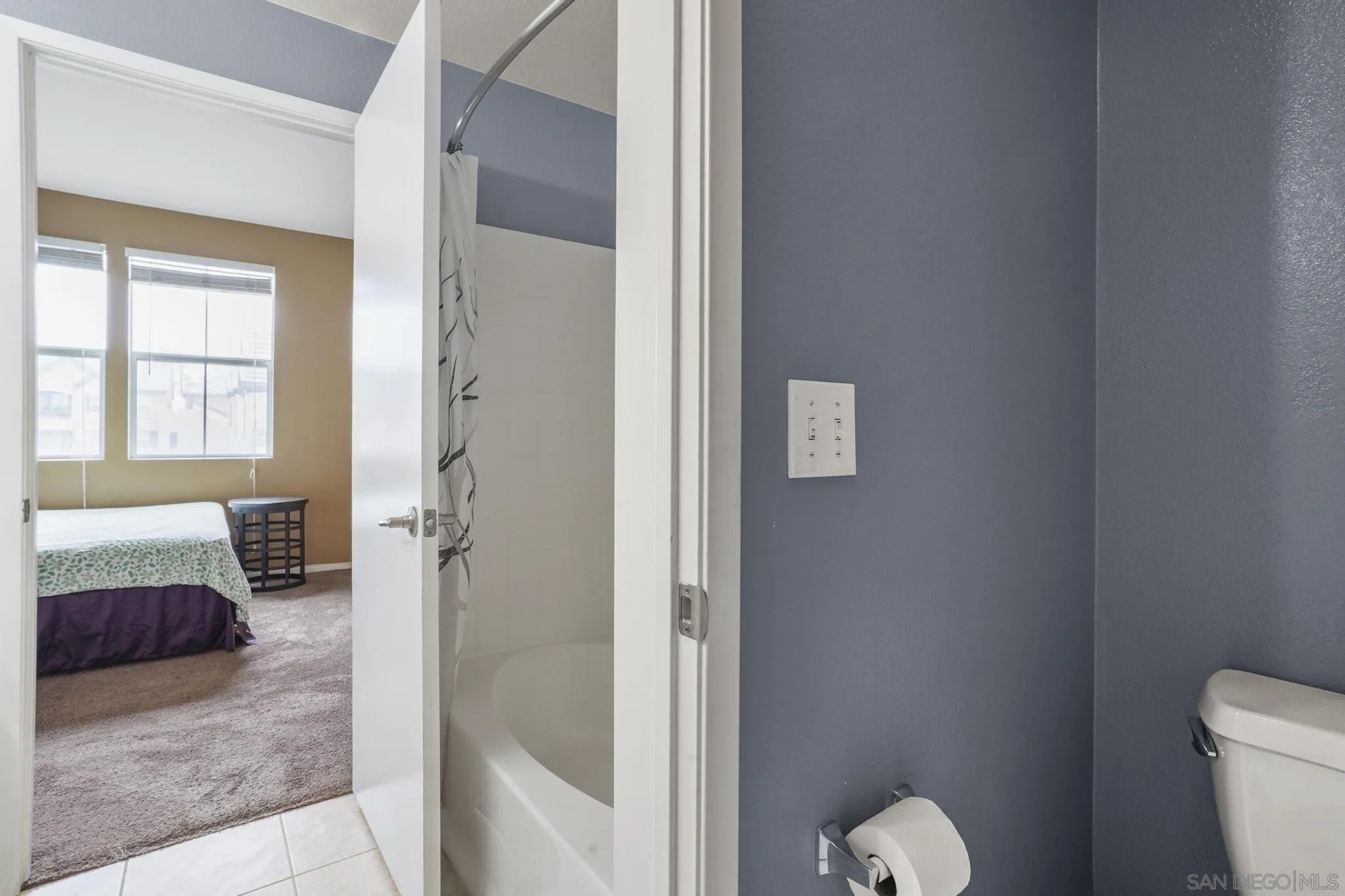1853 Rue Bienville Place, Unit 833 Chula Vista, CA 91913 - Photo 15 of 23 a bathroom with a tub and shower