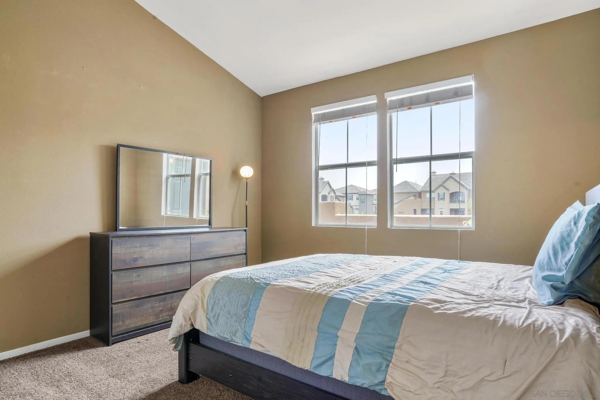 1853 Rue Bienville Place, Unit 833 Chula Vista, CA 91913 - Photo 17 of 23 a bedroom with a bed and window