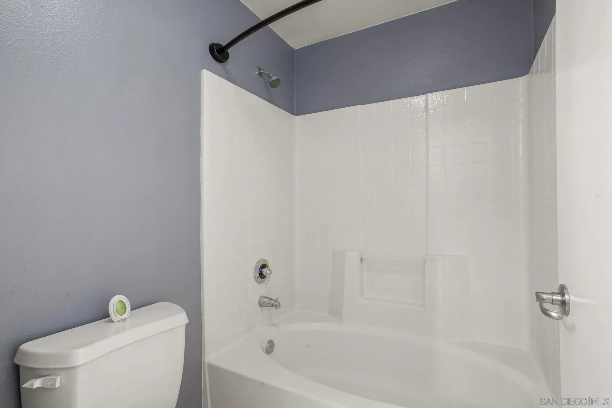1853 Rue Bienville Place, Unit 833 Chula Vista, CA 91913 - Photo 19 of 23 a bathroom with a toilet and a bathtub