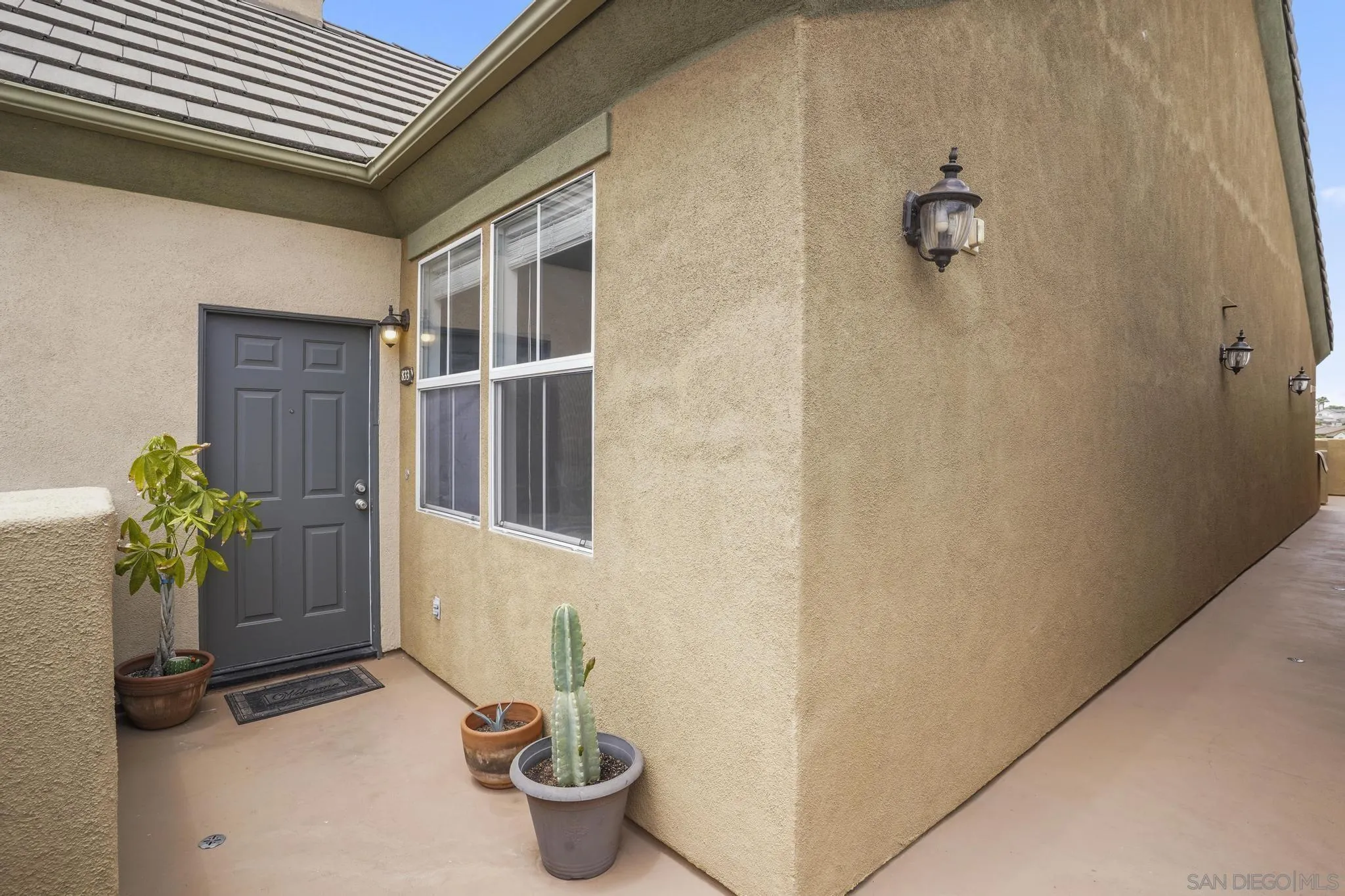 1853 Rue Bienville Place, Unit 833 Chula Vista, CA 91913 - Photo 21 of 23 a potted plant sitting in front of a door