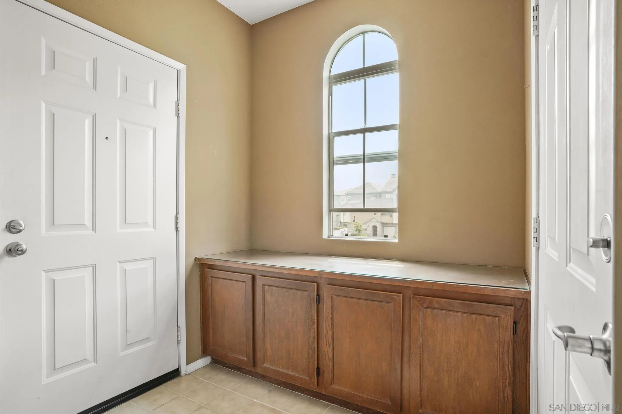 1853 Rue Bienville Place, Unit 833 Chula Vista, CA 91913 - Photo 3 of 23 a hallway with windows