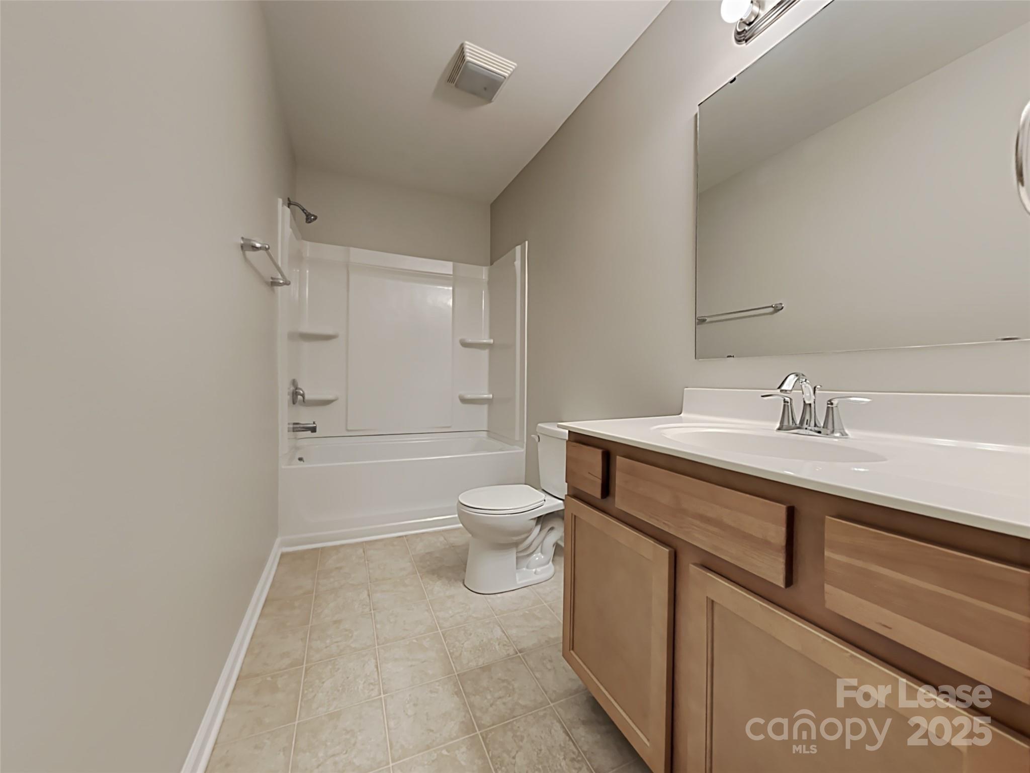 8188 Thornton Street Locust, NC 28097 - Photo 13 of 17 a bathroom with a sink a toilet and shower