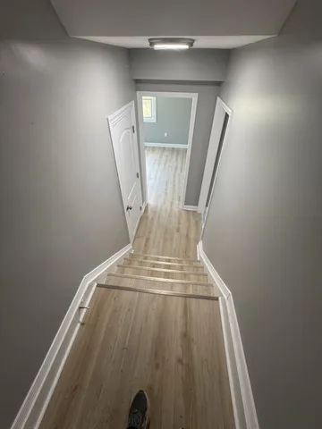 wooden floor with staircase