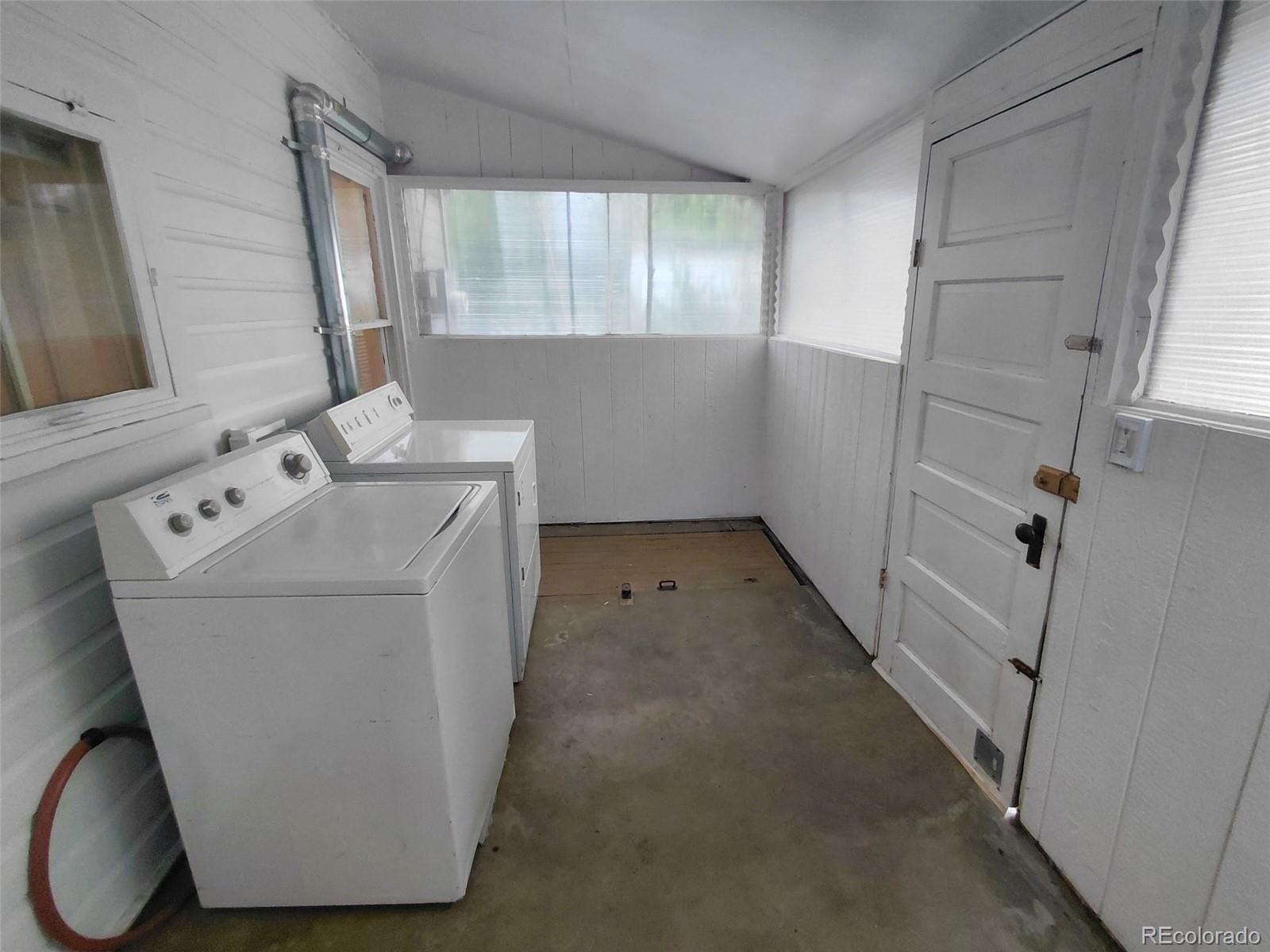 1917 South Fox Street Denver, CO 80223 - Photo 10 of 10 a utility room with cabinets washer and dryer