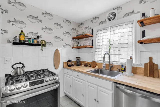 a kitchen with a stove and cabinets