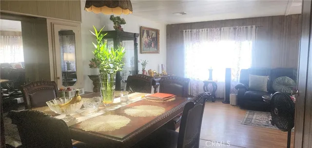 a dining room with furniture and a chandelier