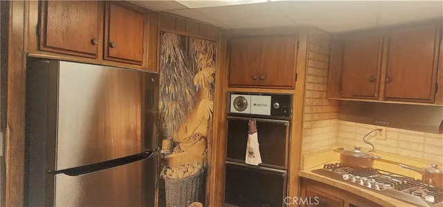 a view of a refrigerator in kitchen