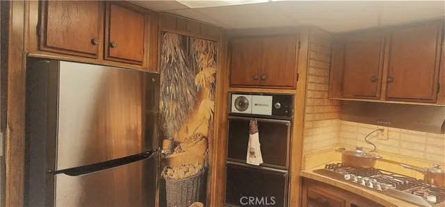 a view of door with wooden cabinets