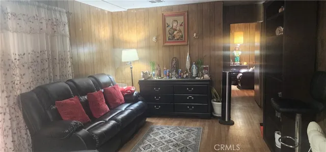 a living room with furniture and a lamp