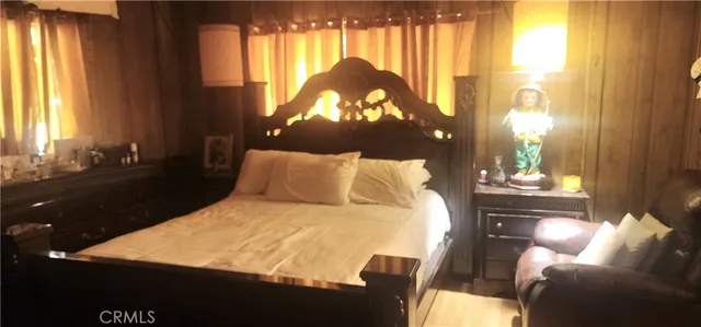 a bed room with a bed and a chandelier