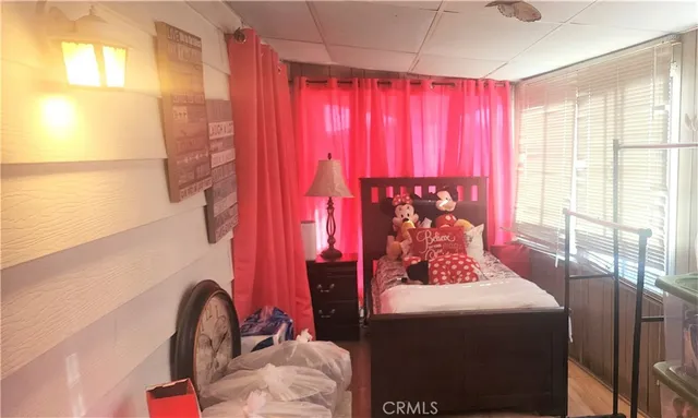 a view of a red door and chair in the backyard