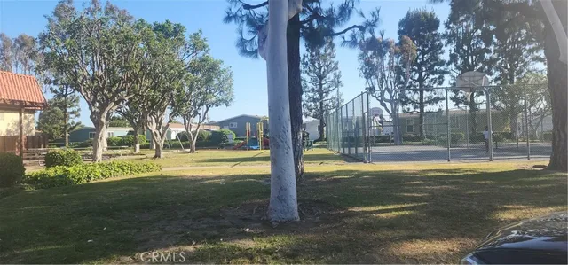 a room with pool table and windows