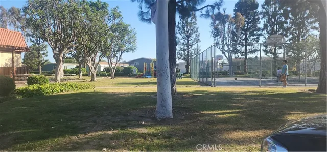 a kitchen with stainless steel appliances granite countertop a refrigerator a stove and a sink