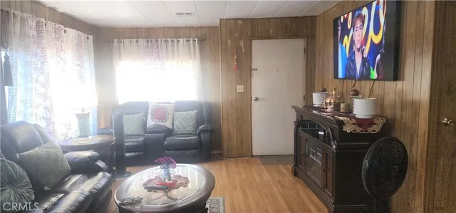 a room with furniture and wooden floor