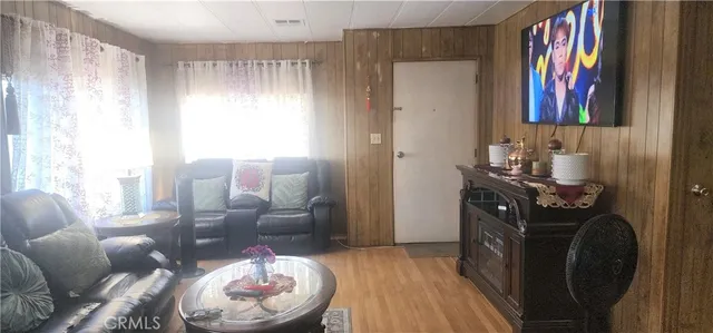 a room with furniture and wooden floor