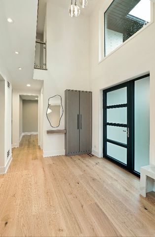 a view of a room with wooden floor and cabinet