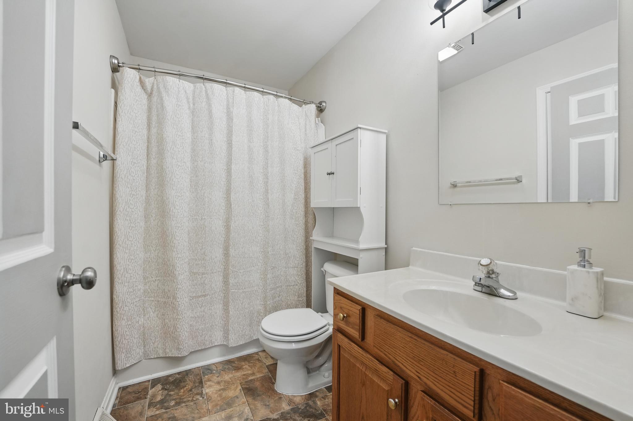 17307 Corder Road Elkwood, VA 22718 - Photo 17 of 20 a bathroom with a granite countertop sink toilet and shower