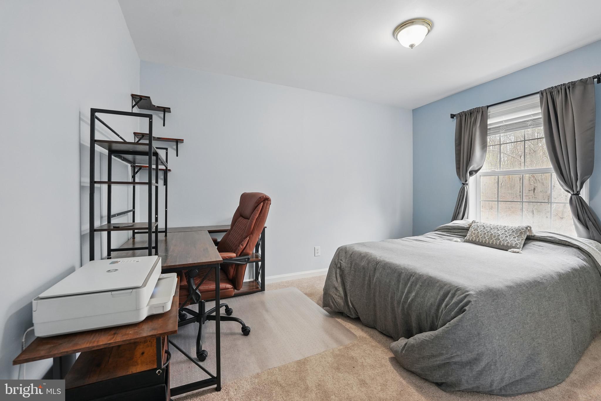 17307 Corder Road Elkwood, VA 22718 - Photo 18 of 20 a bedroom with a bed a chair and a window