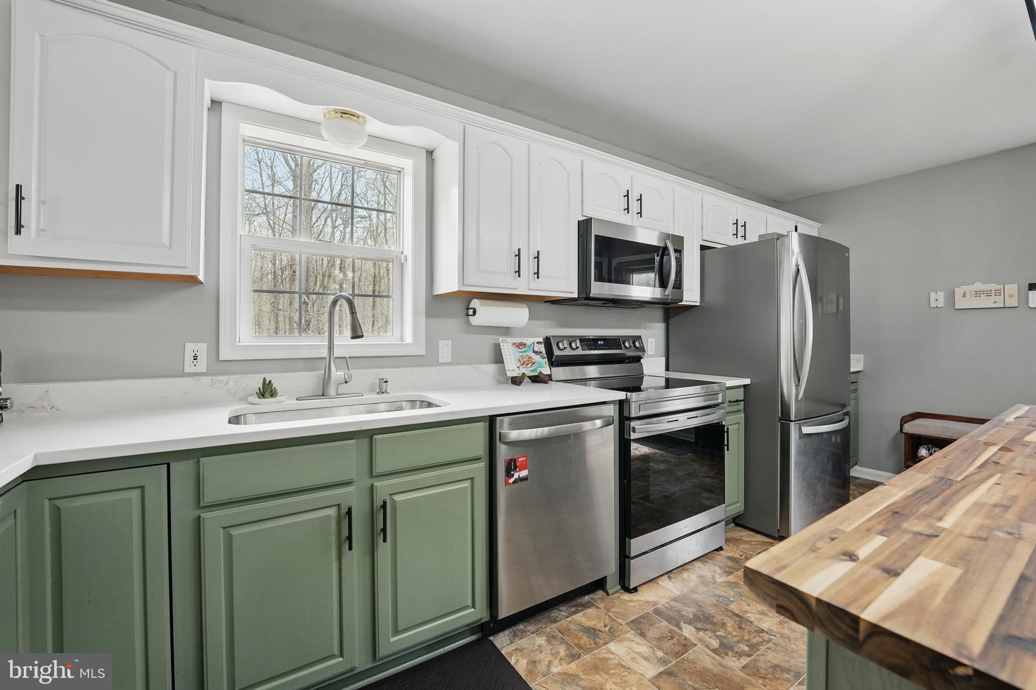 17307 Corder Road Elkwood, VA 22718 - Photo 10 of 20 a kitchen with stainless steel appliances granite countertop a sink stove and refrigerator
