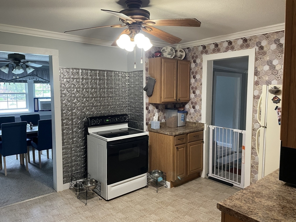 190 Turners Falls Road Montague, MA 01351 - Photo 6 of 35 a kitchen with a stove and a refrigerator