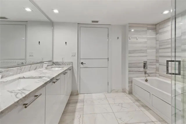 a bathroom with a double vanity sink and a toilet