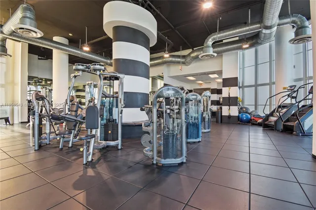 a playing room with furniture and a wooden floor