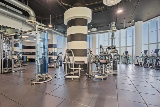 a bathroom with a glass door shower and a bathtub