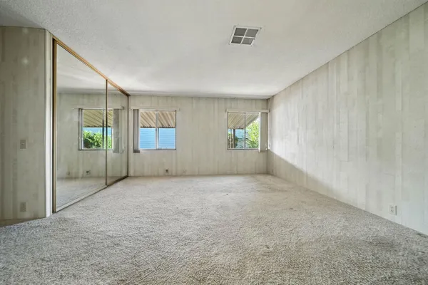 a bathroom with a sink a vanity and a mirror