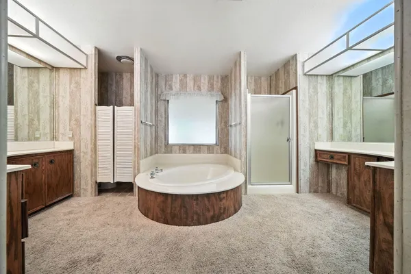 a white bath tub sitting in a bathroom