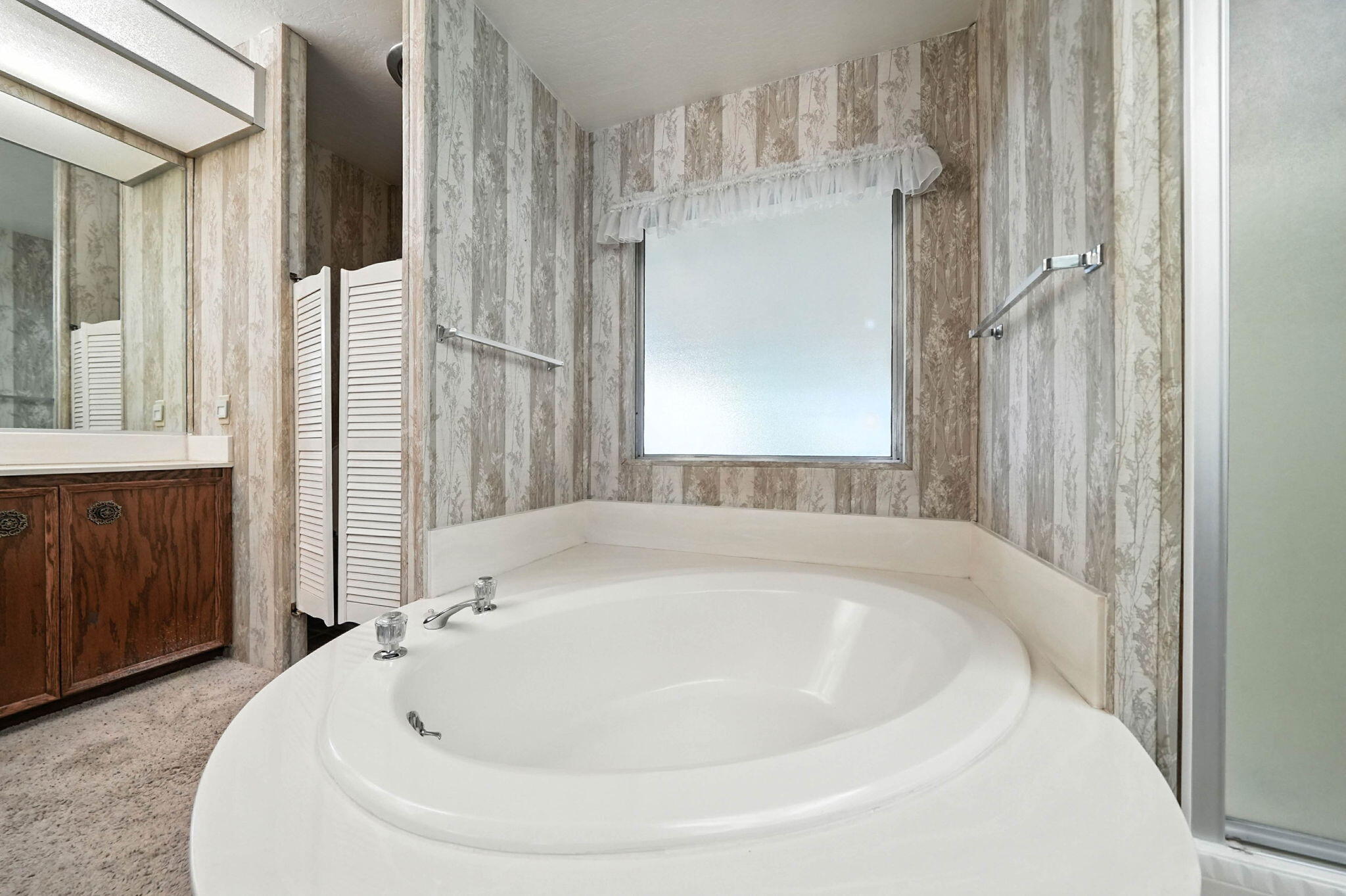 Undisclosed Address Redding, CA 96002 - Photo 19 of 34 a white bath tub sitting in a bathroom