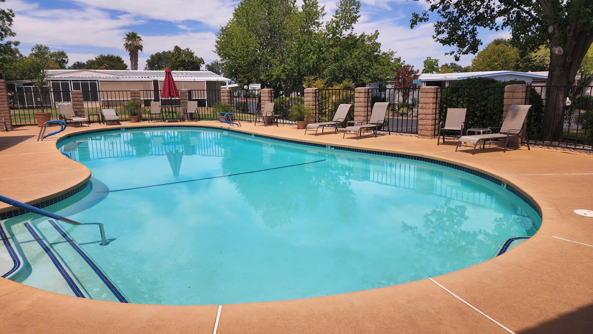 Undisclosed Address Redding, CA 96002 - Photo 31 of 34 a view of a swimming pool with a patio