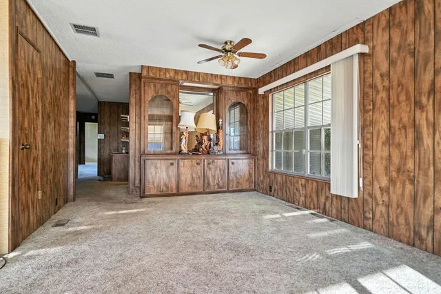 a kitchen with cabinets oven and a dishwasher