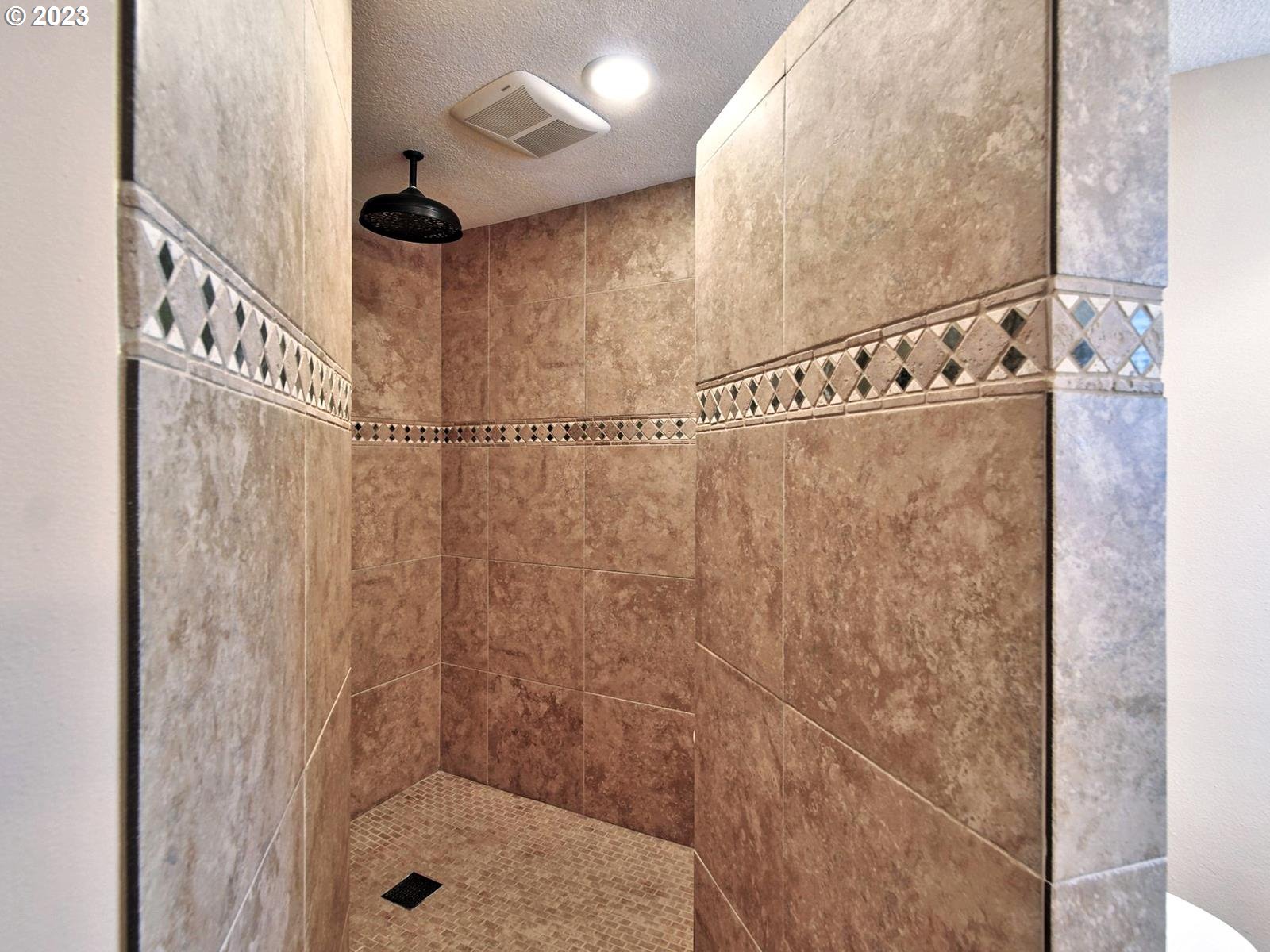 34385 Northeast Sunset Loop Scappoose, OR 97056 - Photo 18 of 42 a bathroom with a shower