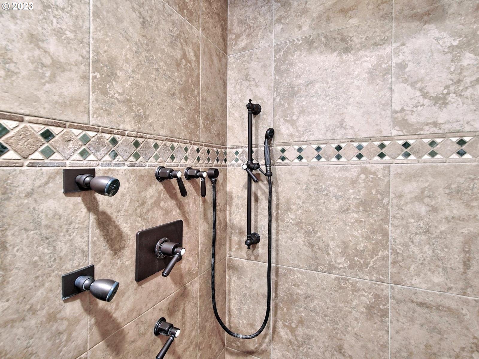 34385 Northeast Sunset Loop Scappoose, OR 97056 - Photo 19 of 42 a bathroom with shower and mirror