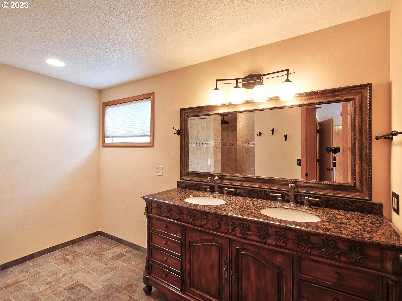 34385 Northeast Sunset Loop Scappoose, OR 97056 - Photo 20 of 42 a bathroom with a double vanity sink and a mirror