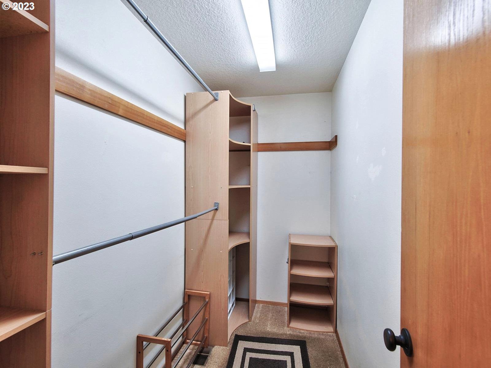 34385 Northeast Sunset Loop Scappoose, OR 97056 - Photo 21 of 42 a view of walk in closet with empty racks