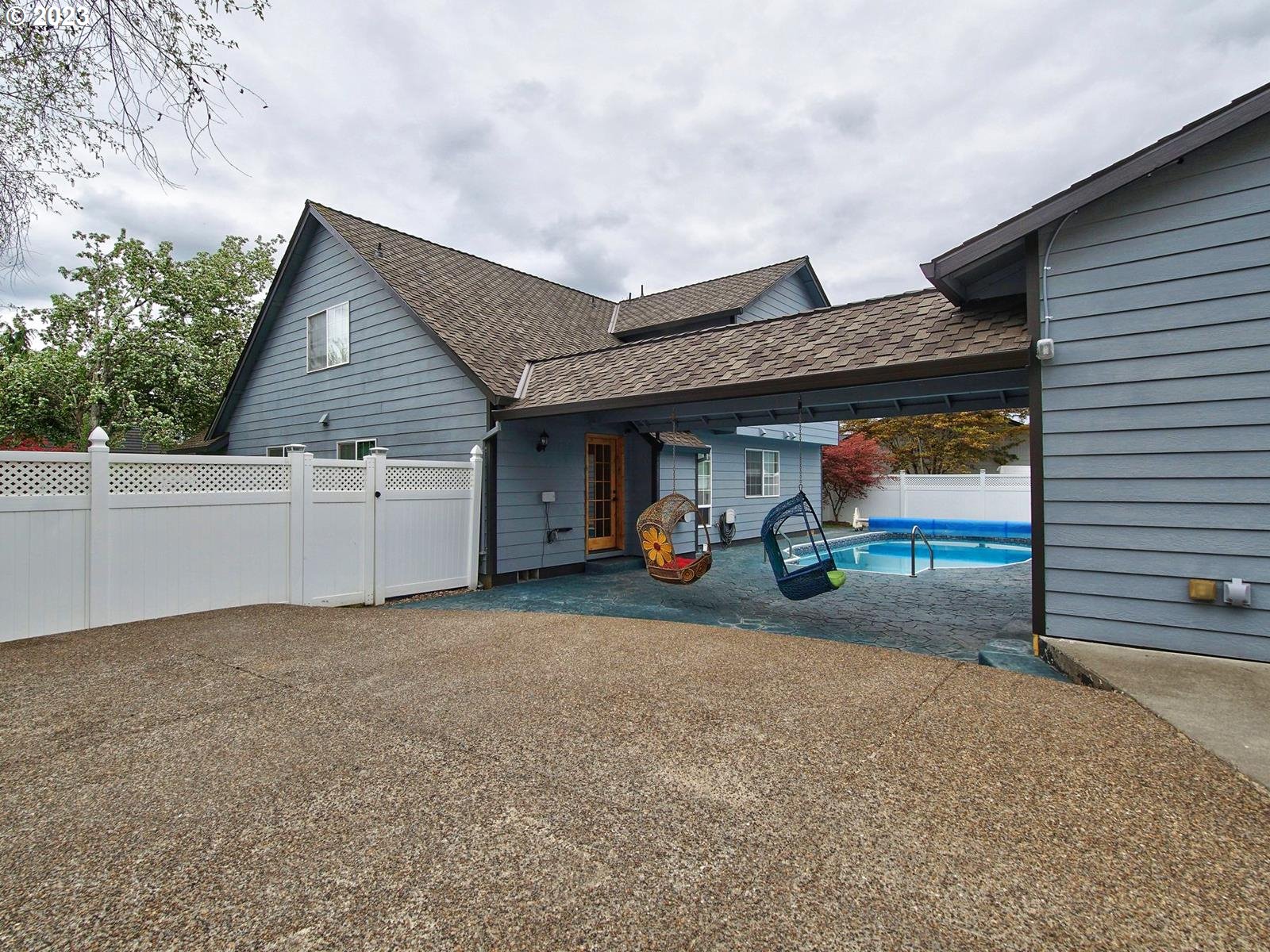 34385 Northeast Sunset Loop Scappoose, OR 97056 - Photo 28 of 42 a view of a house with porch and a car parked