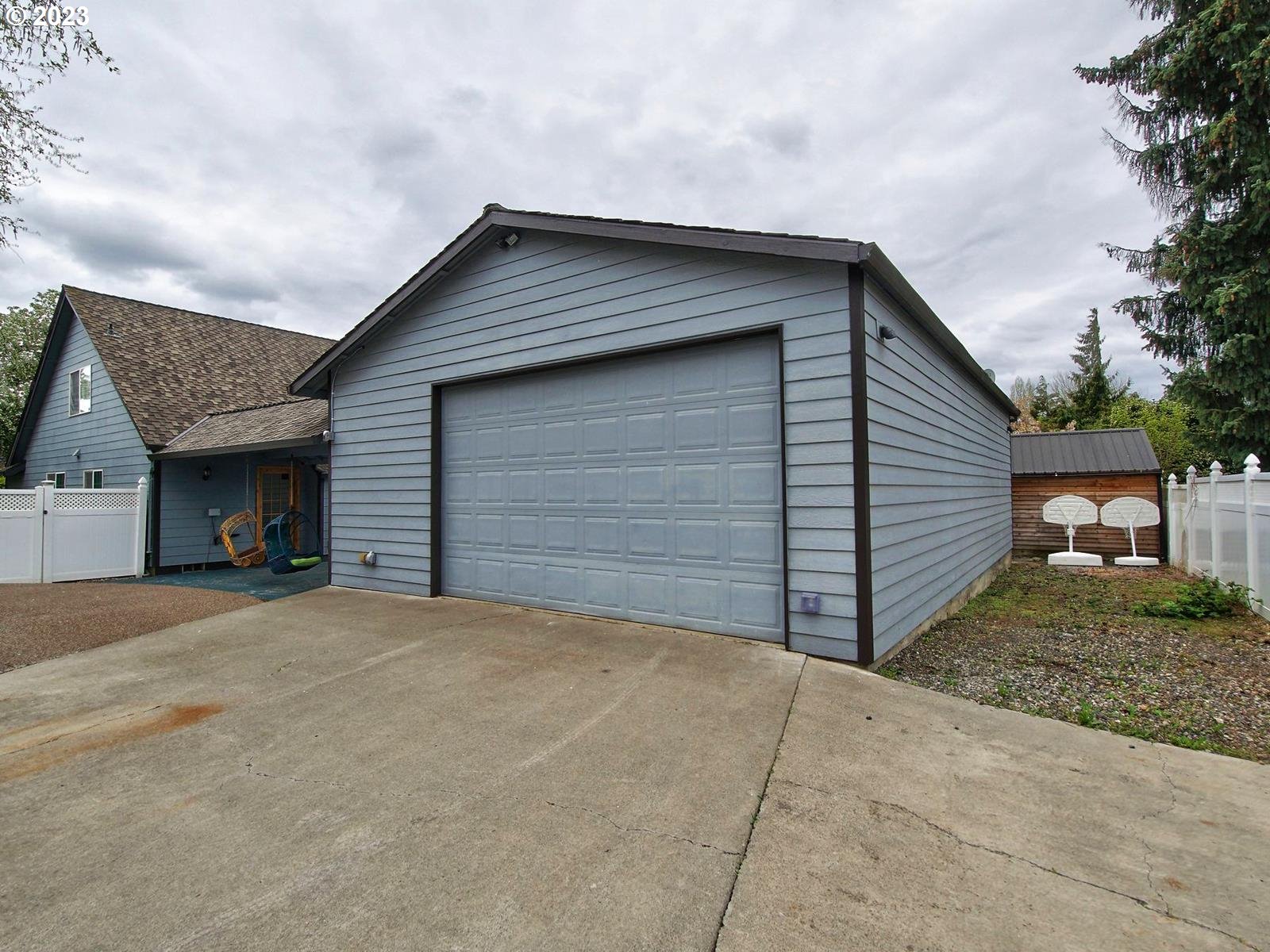 34385 Northeast Sunset Loop Scappoose, OR 97056 - Photo 29 of 42 a front view of a house with garage