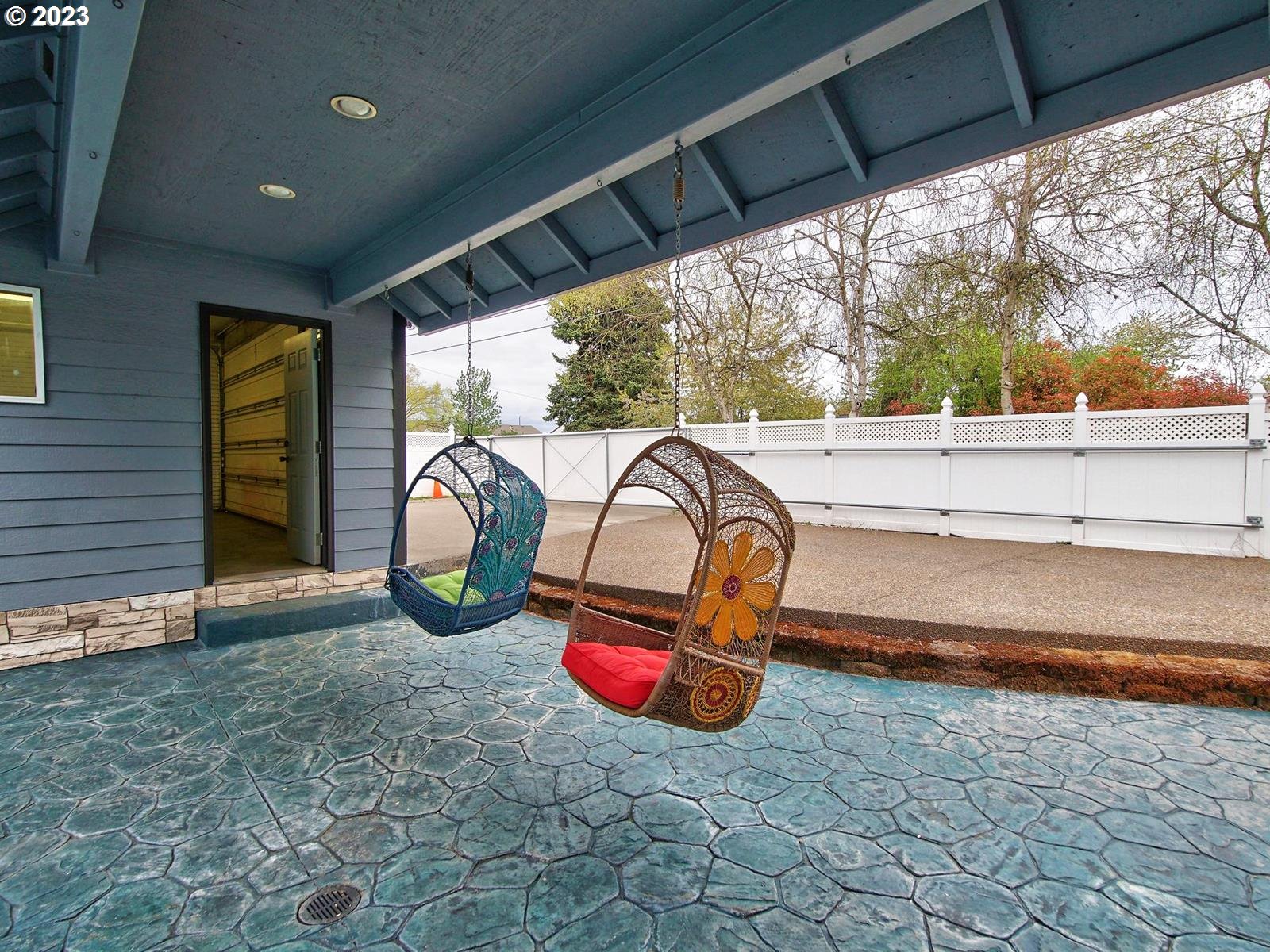 34385 Northeast Sunset Loop Scappoose, OR 97056 - Photo 33 of 42 a view of a porch with furniture and a yard