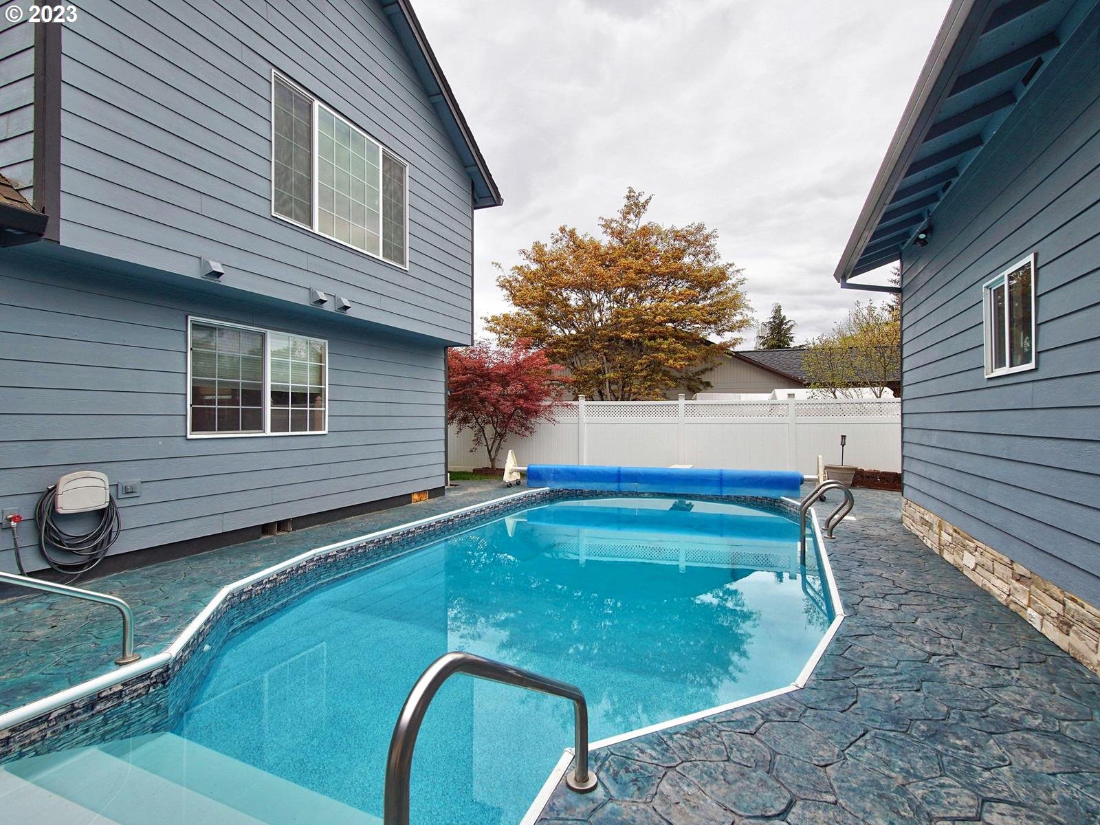 34385 Northeast Sunset Loop Scappoose, OR 97056 - Photo 34 of 42 a backyard of a house with outdoor seating