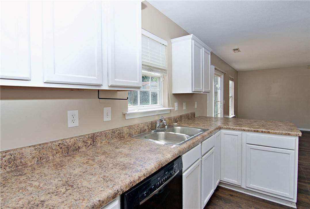 305 North Chestnut Street Seneca, SC 29678 - Photo 15 of 44 A well-appointed kitchen offers ample counter space and seamless transitions to the dining area.