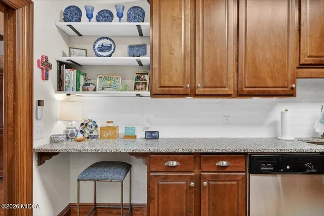 a bedroom with a bed a couch and dresser