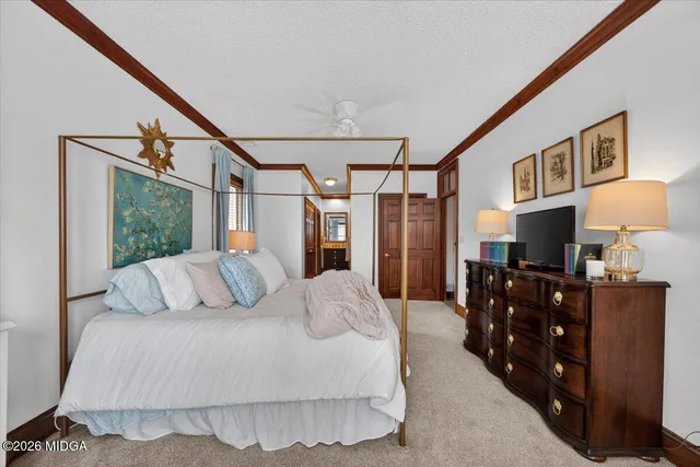 a bedroom with a bed and a table