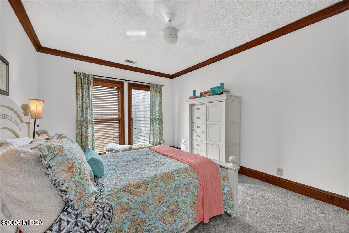 175 Corbin Avenue Macon, GA 31204 - Photo 20 of 21 a bedroom with a large bed and a window
