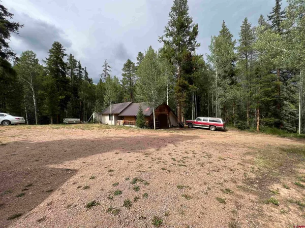 a bedroom with two beds and a window