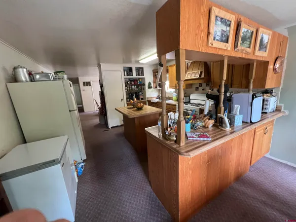 a bedroom with two bed and a window